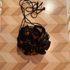 Elegant Black and Gold Drawstring Bag jewelry holder.
